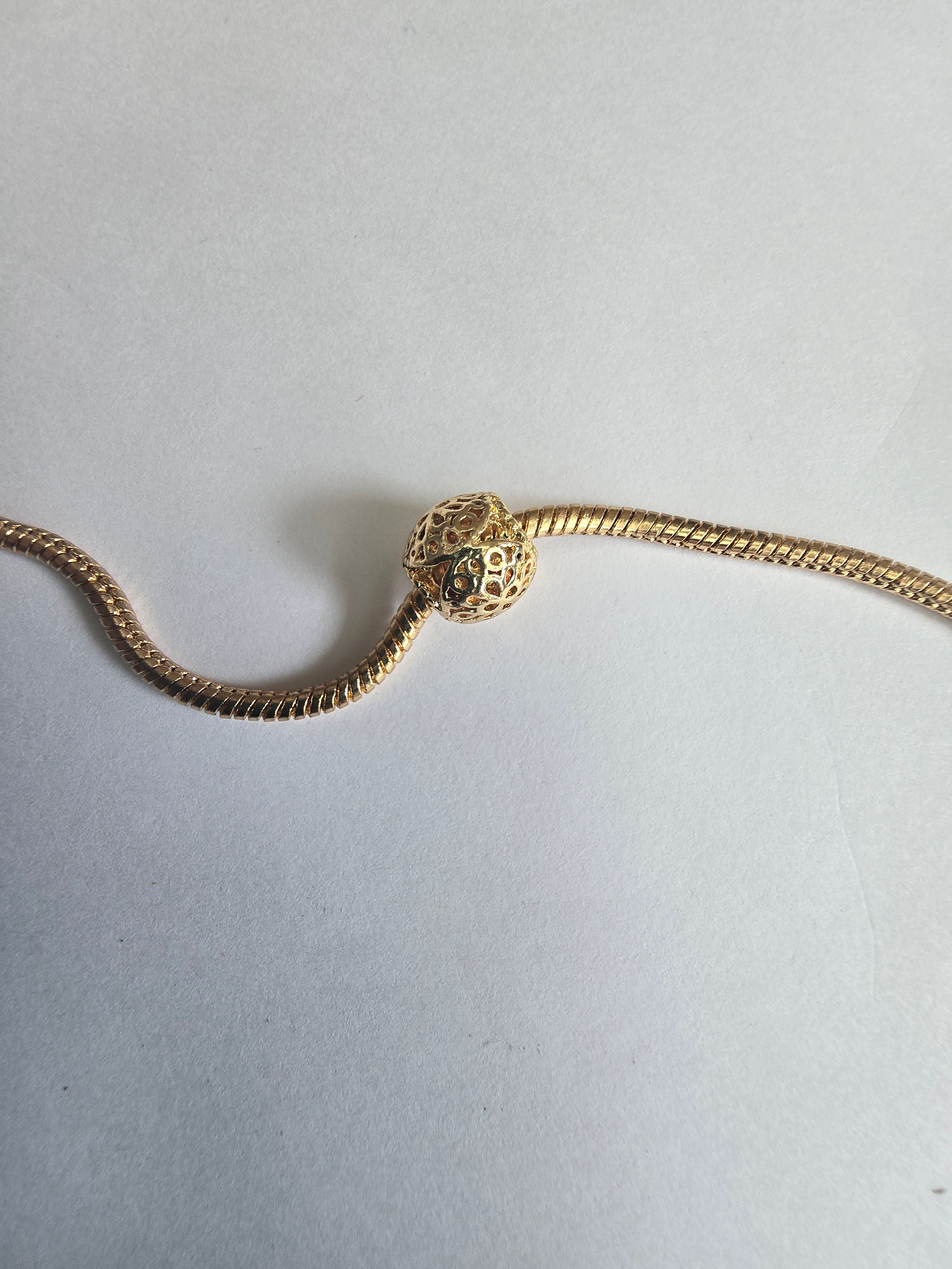 Gold charm fits all charm bracelets