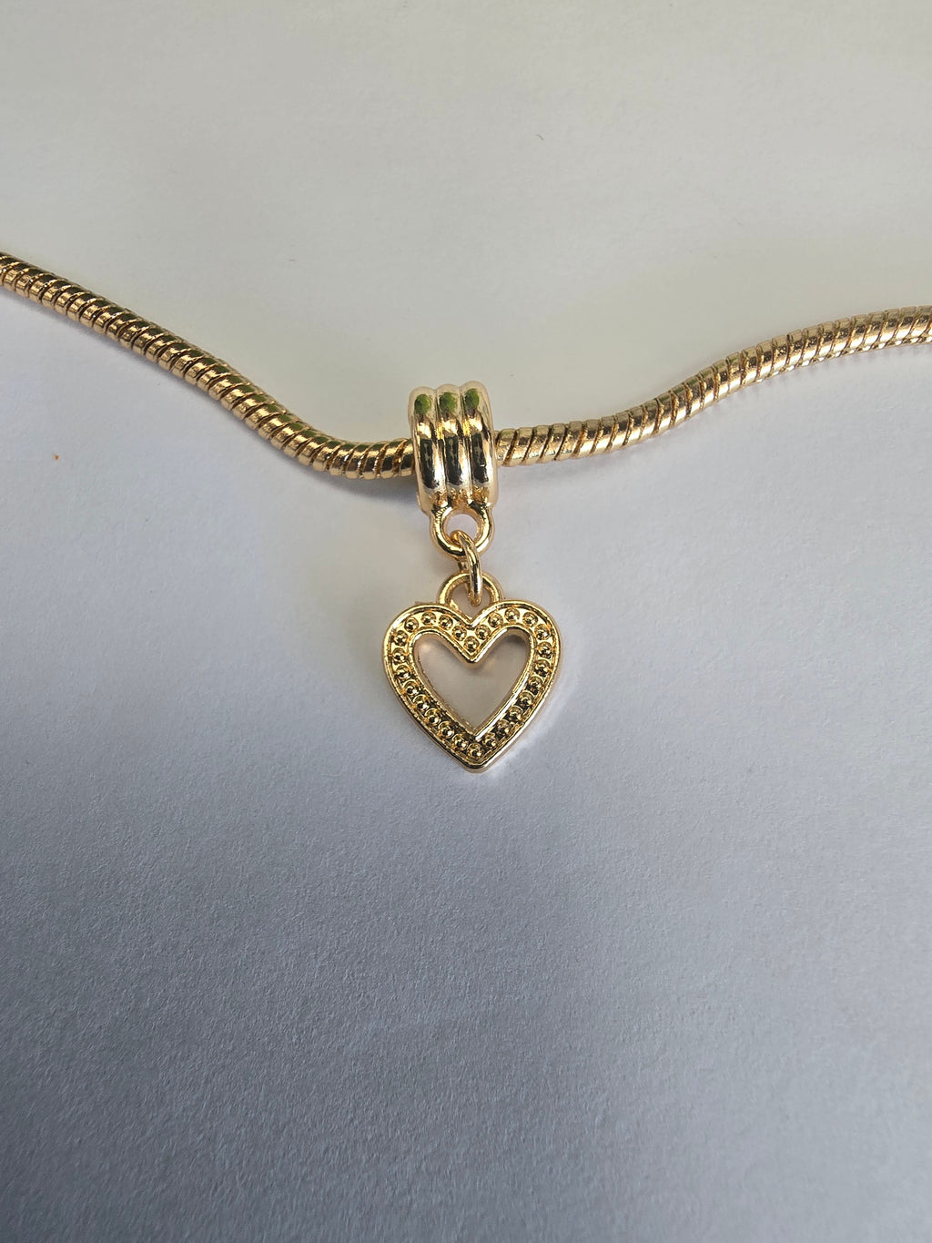 Gold charm fits all charm bracelets